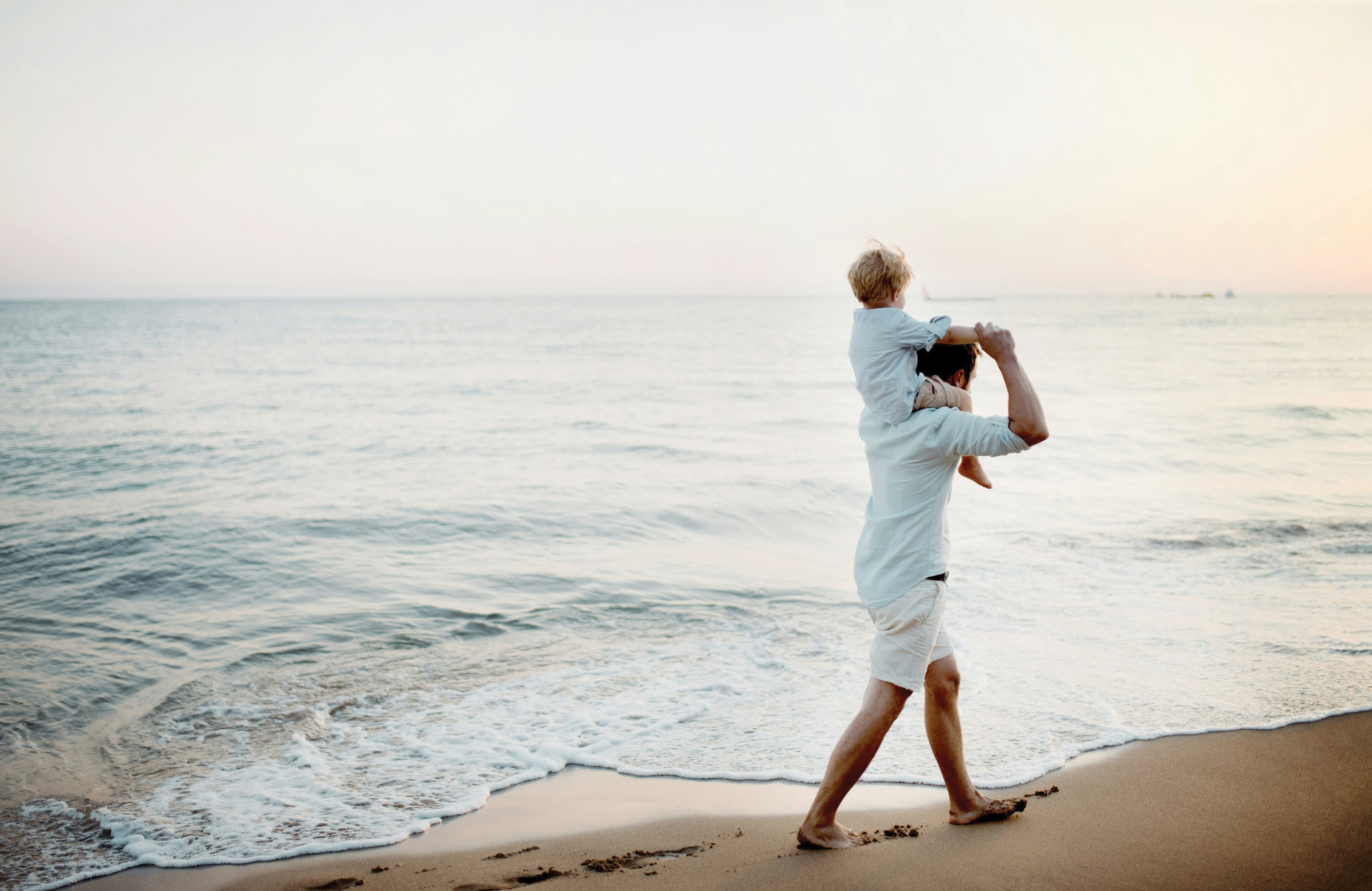 Father and child on the beach